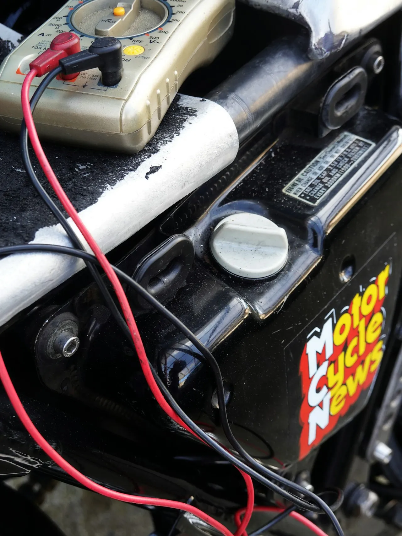 Refrigeration compressor unit on a service bench under inspection.