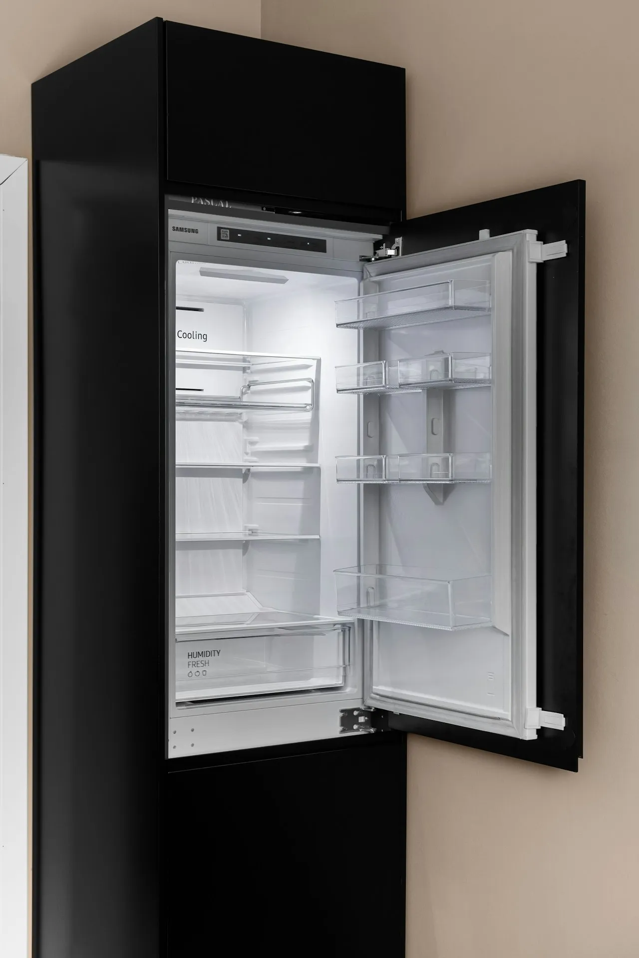Technician hands inspecting a sealed refrigeration system.